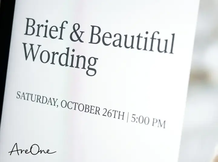 Close-up of beautiful digital typography on a minimalist wedding invite highlighting elegant serif fonts.